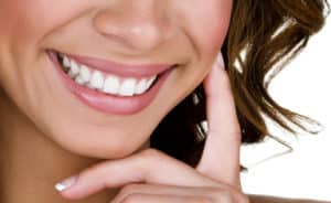 Closeup of a woman with perfect teeth smiling