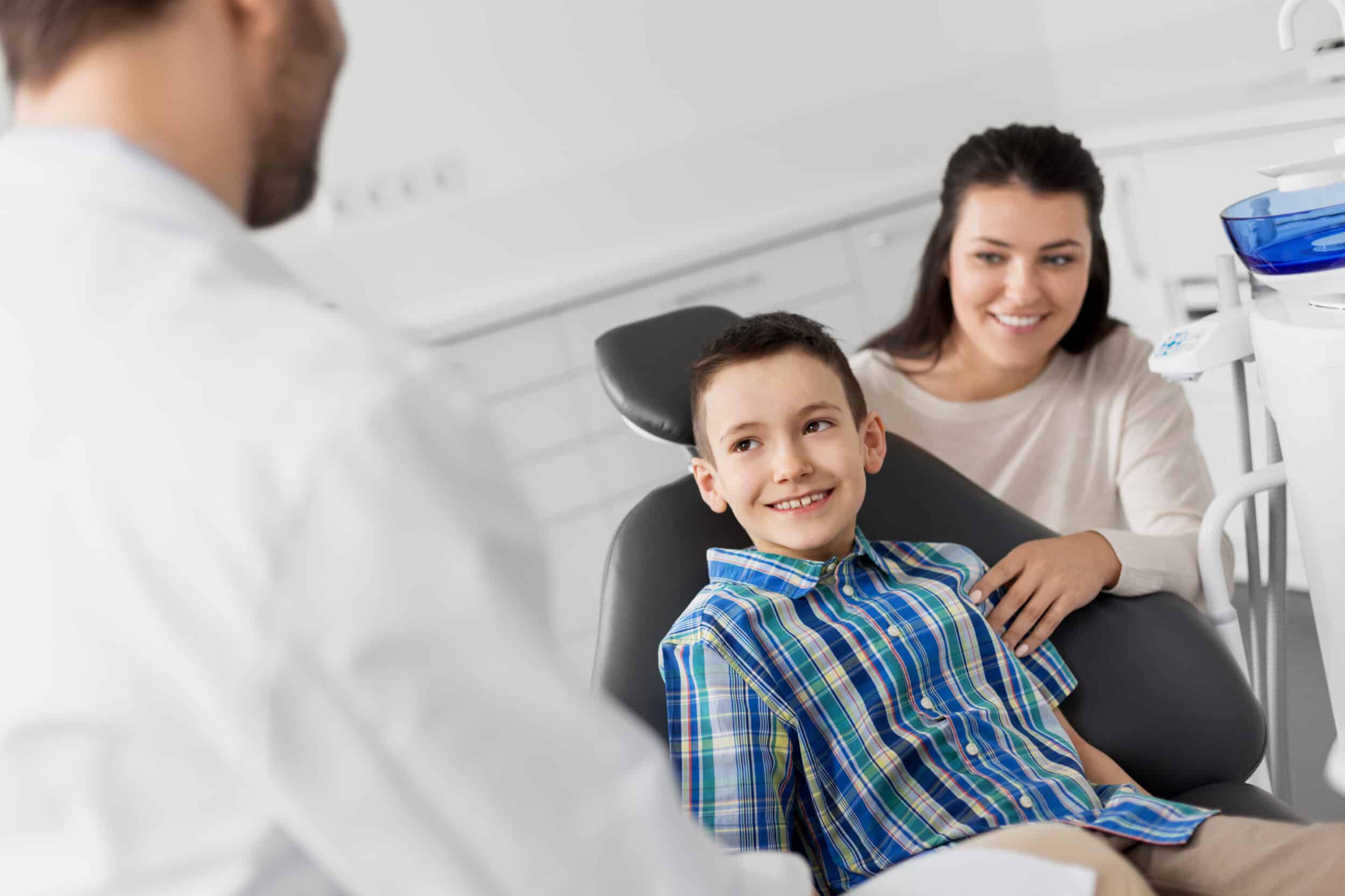 Mother with son at family dental appointment