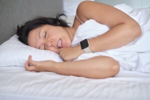 Woman grinding her teeth in her sleep.